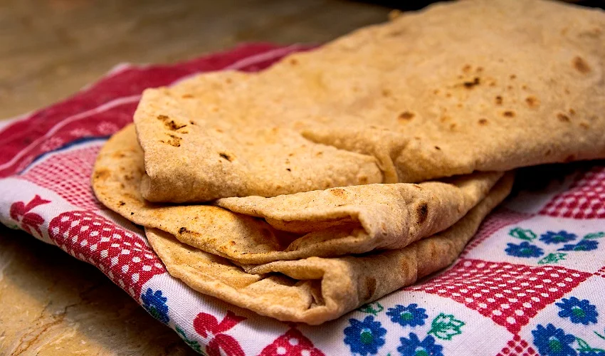 Freshly baked roti with visible grains - a source of protein